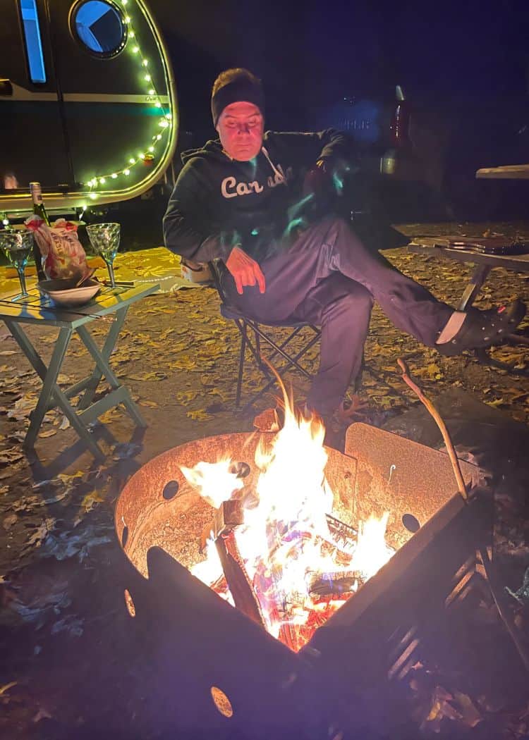 Turkey Point Provincial Park - Hubby in front of fire at campsite