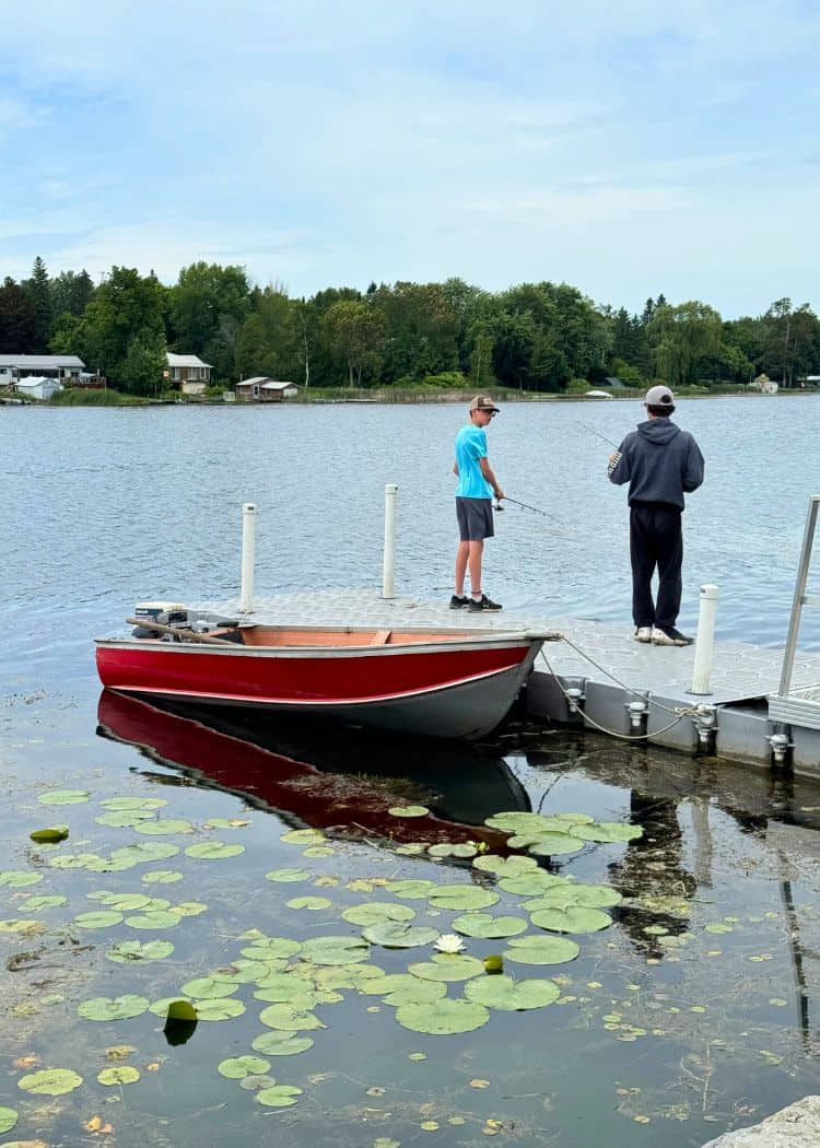 Emily Provincial Park - Kids fishing off floating dock at Campground Beach