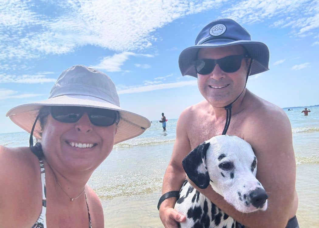 John and I at the beach with Guinness
