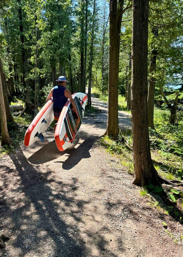 Bruce Peninsula National Park - Hubby carrying the paddleboards to the lake from our campsite