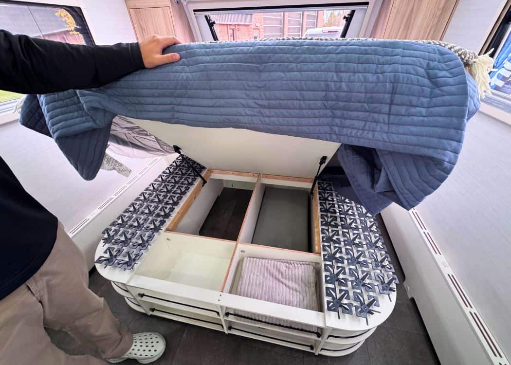 nuCamp Haven 220 - Lifting the bed to access storage