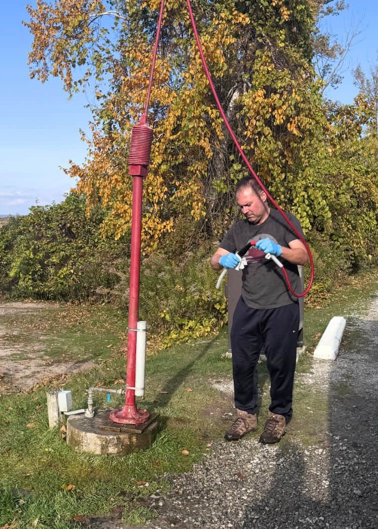 Dump Station - John sanitizing the hose after use