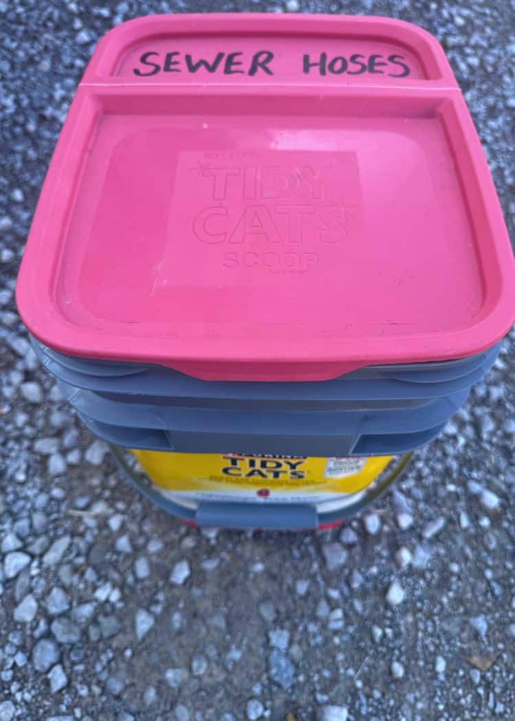 Dump Station - We store our hose and cleaning supplies insode an old kitty litter pail