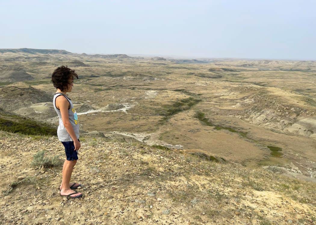 Grasslands NP - Boy admiring views of Badlands