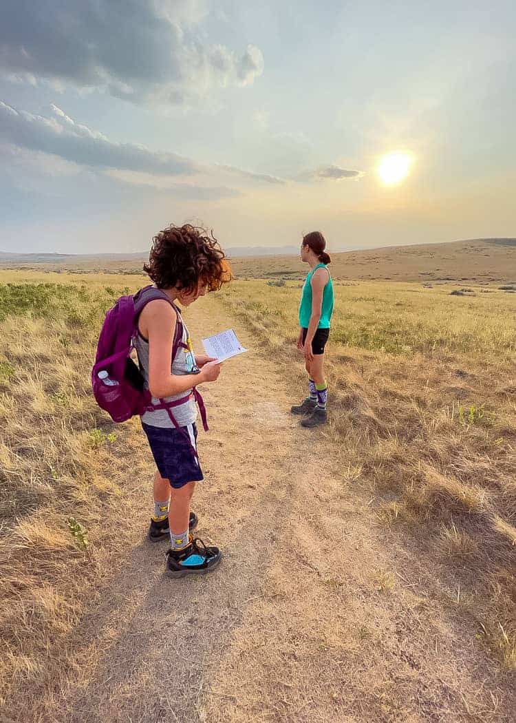 Grasslands-Rock-Creek-Trail-looking-at-interpretive-material