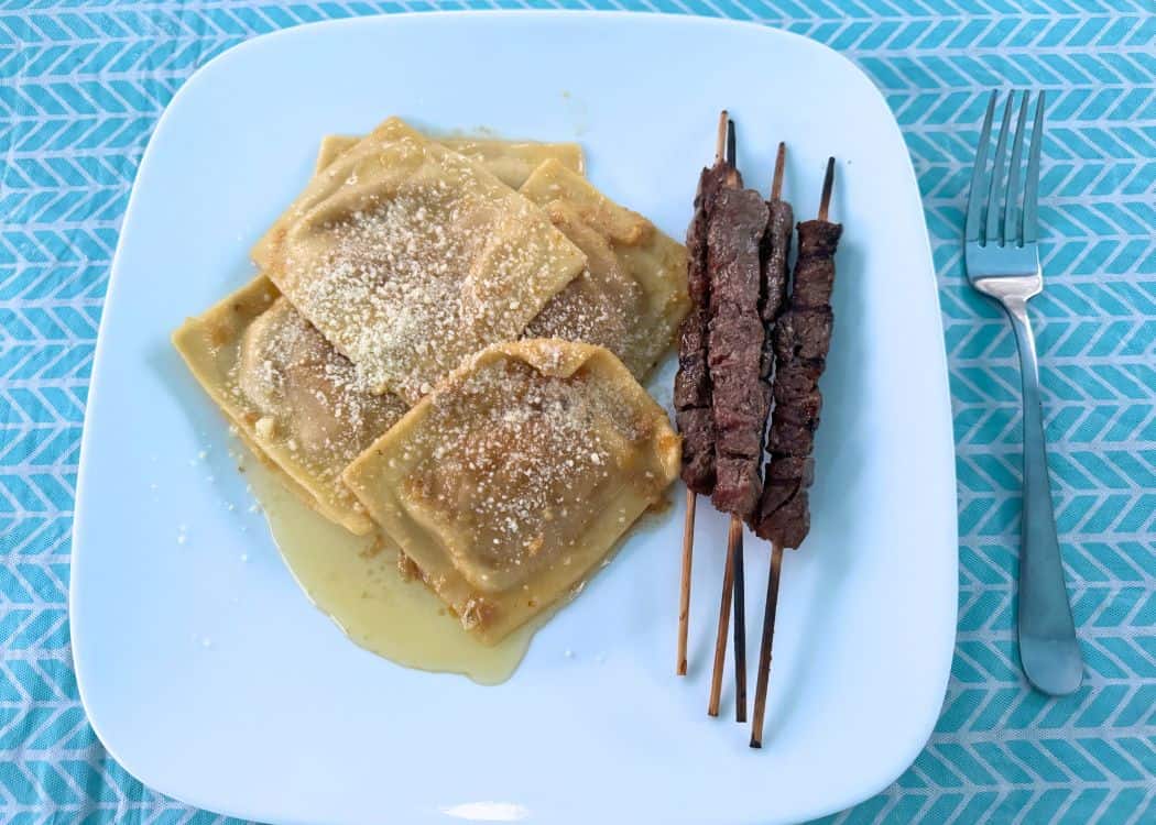 What We Eat While Camping - Ravioli in brown butter sauce with lamb spiedini